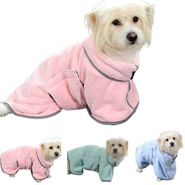 A dog wearing the microfiber dog towel in pink. 3 dogs at the bottom, each wearing a pink, green and blue microfiber dog towl.